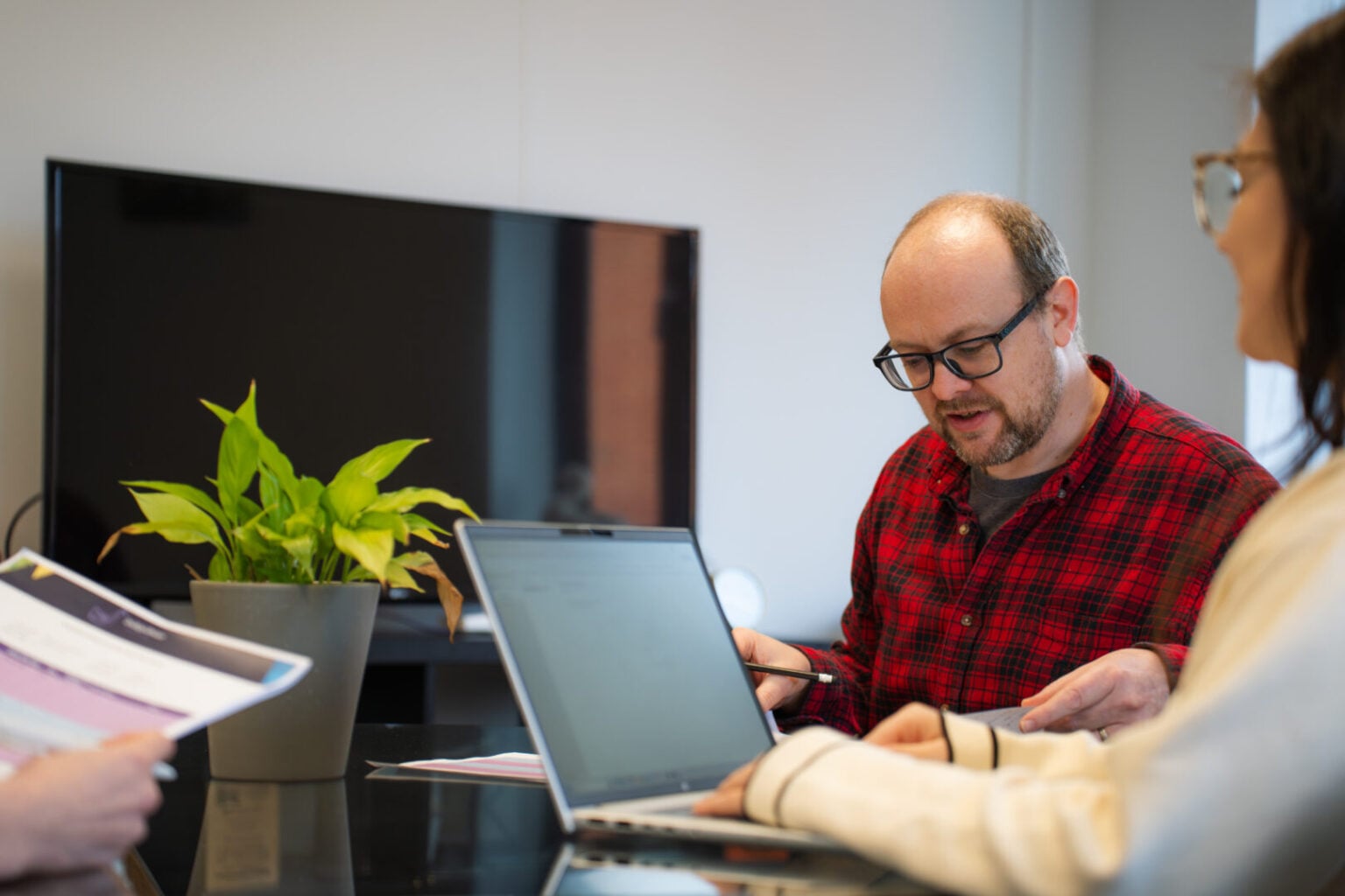 Woman and man looking at laptop